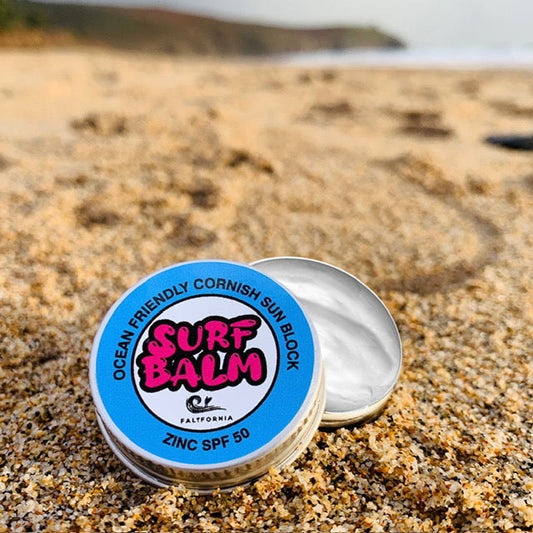 Surf Balm aluminium tin on the sand